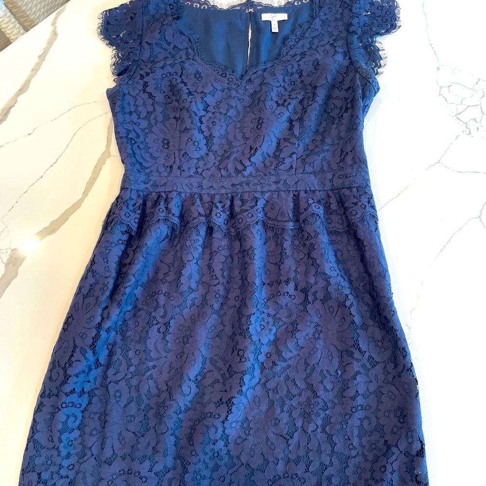 Navy fit and flare Joie lace dress with small lace peplum on the waist.